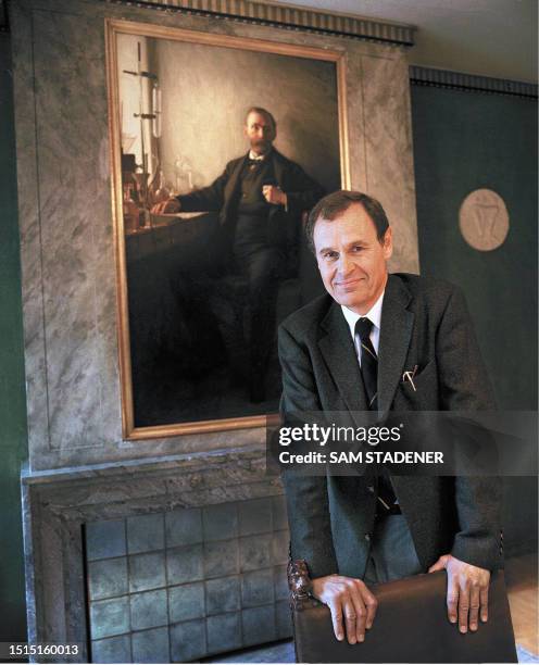 Photo taken 02 October 1997 of Michael Sohlman, executive director of the Nobel Foundation and the grandson of Alfred Nobel, seen on the wall behind....