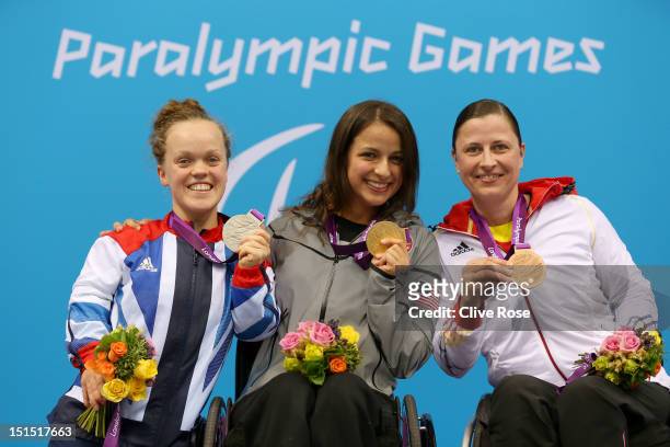 Silver medallist Eeanor Simmonds of Great Britain, gold medallist Victoria Arlen of the United States and bronze medallist Tanja Groepper of Germany...