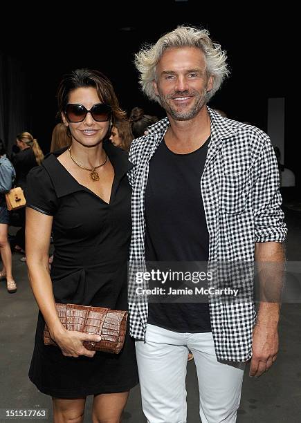 Gina Gershon and Bobby Kaiser attend the Edun show during Spring 2013 Mercedes-Benz Fashion Week at Skylight at Moynihan Station on September 8, 2012...