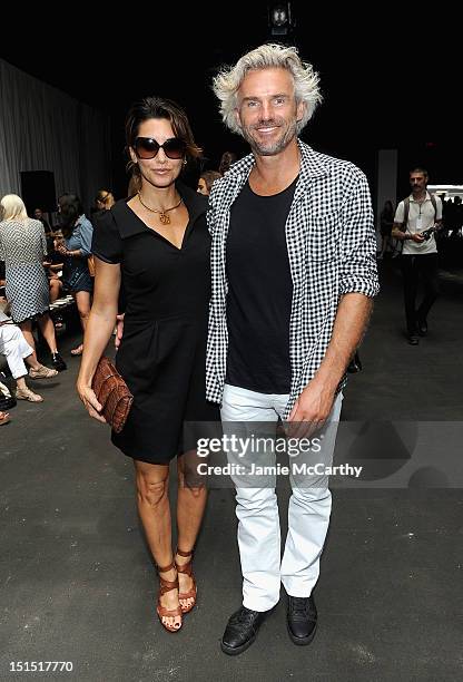 Gina Gershon and Bobby Kaiser attend the Edun show during Spring 2013 Mercedes-Benz Fashion Week at Skylight at Moynihan Station on September 8, 2012...