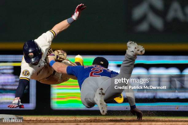 Nico Hoerner of the Chicago Cubs tags out Owen Miller of the Milwaukee Brewers at second base in the 10th inning at American Family Field on July 04,...