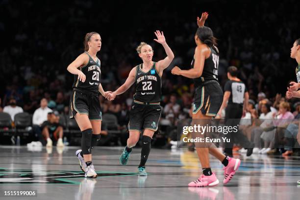 Sabrina Ionescu, Courtney Vandersloot and Betnijah Laney of the New York Liberty celebrates during the game against the Seattle Storm on July 8, 2023...
