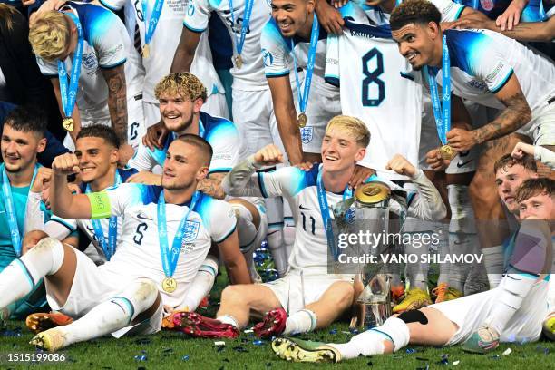 England's players celebrate with the trophy after winning the UEFA European Under-21 Championship final football match between England vs Spain at...