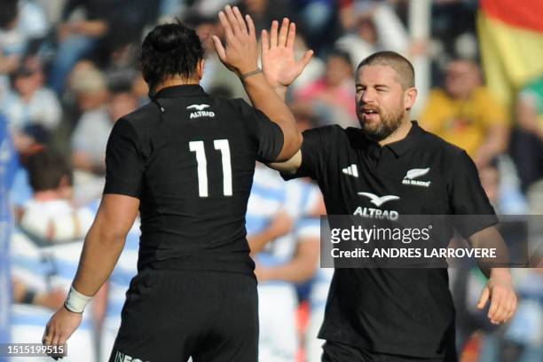 New Zealand's Caleb Clarke and New Zealand's Dane Coles celebrate after scoring a try during the Rugby Championship 2023 first round match between...