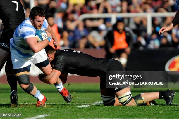 Argentina's Julián Montoya is tackled by New Zealand's Josh Lord during the Rugby Championship 2023 first round match between Argentina's Los Pumas...