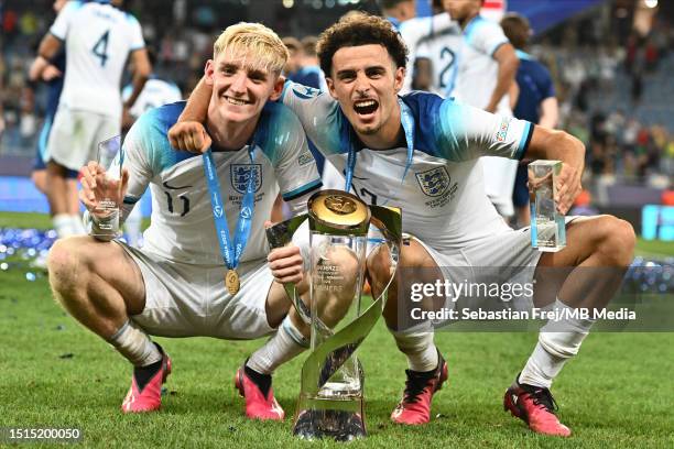 England's players Anthony Gordon, Curtis Jones celebrate with the trophy after winning the UEFA European Under-21 Championship final match between...