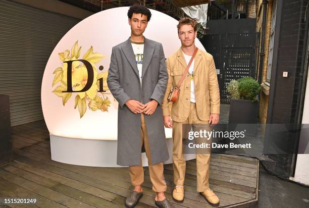 Archie Madekwe and Will Poulter attend the Dior Tears pop-up launch party on July 8, 2023 in London, England.