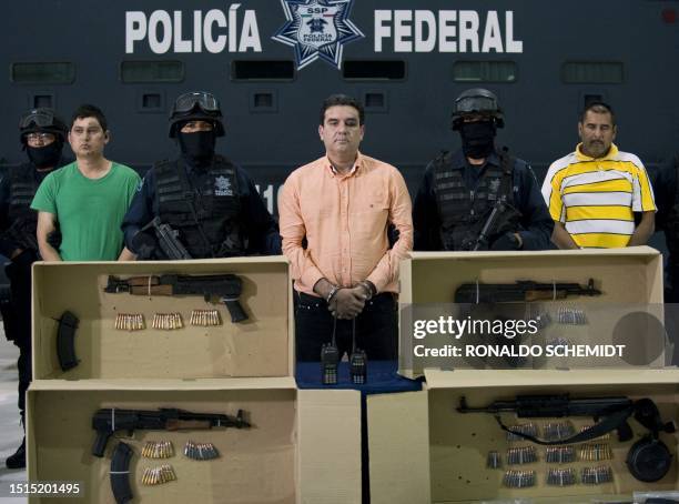 Alleged drug trafficker Manuel Fernandez Valencia aka "La Puerca" and other members of the Sinaloa cartel are presented to the press in Mexico City,...