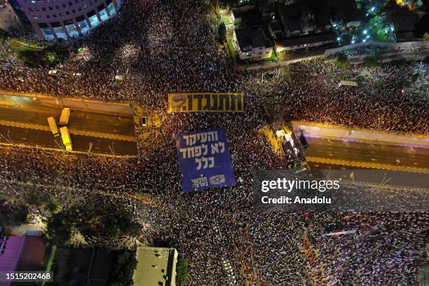 An aerial view of the Kaplan Street as people, carrying flags, various banners and placards, gather to protest Prime Minister Benjamin Netanyahu's...