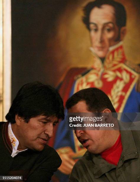 Venezuelan President Hugo Chavez chats with his Bolivian counterpart Evo Morales during a meeting of the leaders of the Bolivarian Alternative group...
