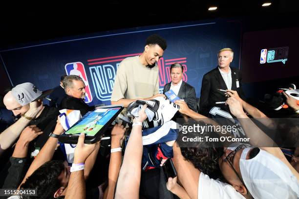 Victor Wembanyama of the San Antonio Spurs signs autographs during NBA Con as part of the 2023 Las Vegas Summer League on July 8, 2023 at the...