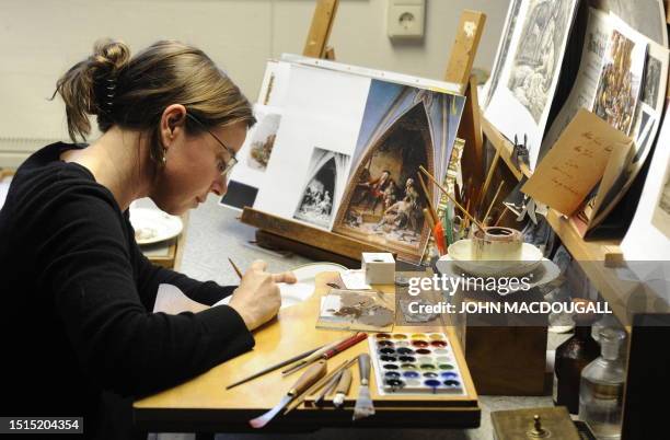 Craftswoman paints a scene on a porcelain plate at the Meissen porcelain manufacture in Meissen January 20, 2010. The Meissen porcelain manufacture,...