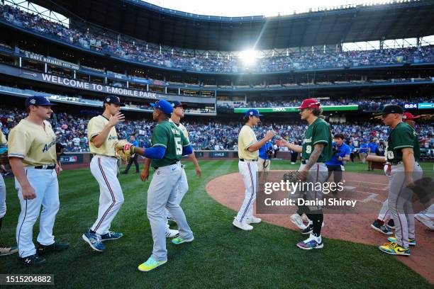 Members of the American and National League teams celebrate after the SiriusXM All-Star Futures Game at T-Mobile Park on Saturday, July 8, 2023 in...