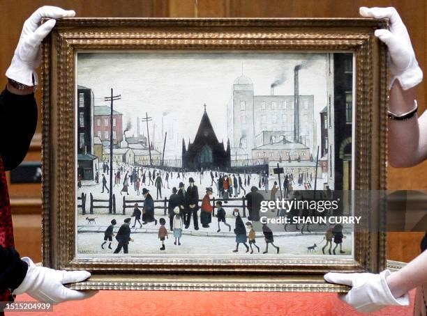 Painting entitled 'An Old Church' 1943 by British artist Laurence Stephen Lowry is pictured at Christie's auction house in London, on May 30, 2008....