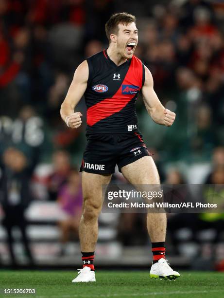Zach Merrett of the Bombers celebrates a goal during the 2023 AFL Round 17 match between the Essendon Bombers and the Adelaide Crows at Marvel...