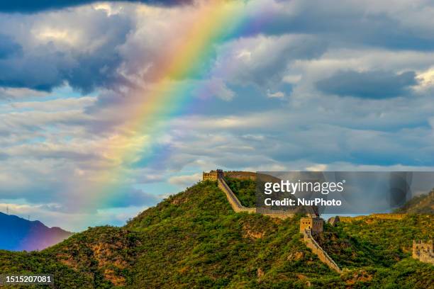Photo taken on July 8, 2023 shows a colorful rainbow after rain in the sky at the Jinshanling Great Wall Scenic spot in Luanping County, Chengde...