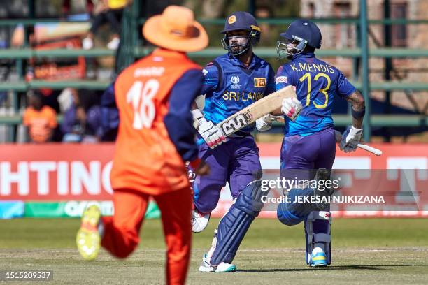 Sri Lanka's Sahan Arachchige and Kusal Mendis run between the wickets during the ICC Men's Cricket World Cup Qualifier Zimbabwe 2023 final match...