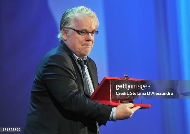 Actor Philip Seymour Hoffman receives Special Jury Prize for best director on behalf of director Paul Thomas Anderson during the Award Ceremony...