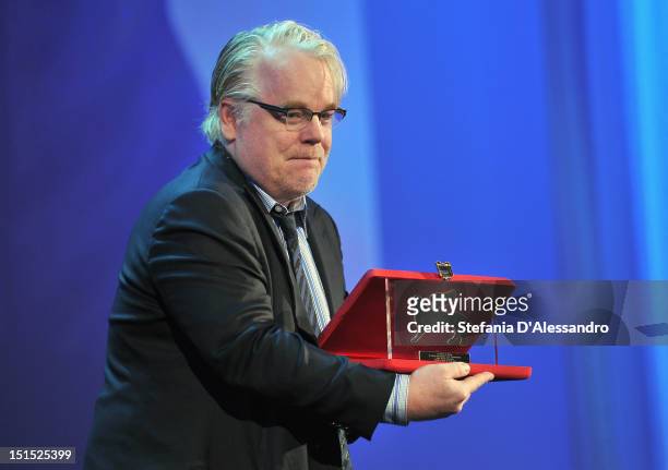 Actor Philip Seymour Hoffman receives Special Jury Prize for best director on behalf of director Paul Thomas Anderson during the Award Ceremony...