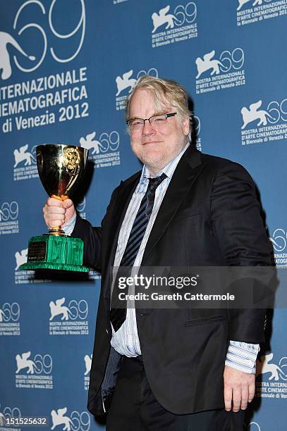 Actor Philip Seymour Hoffman of "The Master" with the Coppa Volpi Award for "Best Actor" during the Award Winners Photocall during The 69th Venice...