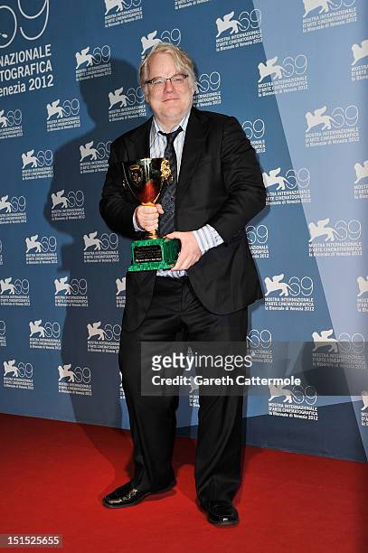 Actor Philip Seymour Hoffman of "The Master" with the Coppa Volpi Award for "Best Actor" during the Award Winners Photocall during The 69th Venice...