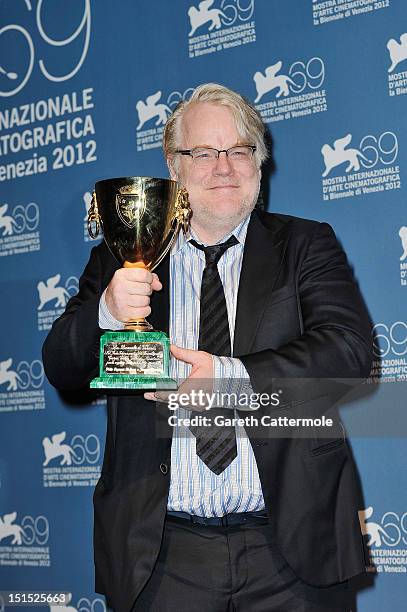 Actor Philip Seymour Hoffman of "The Master" with the Coppa Volpi Award for "Best Actor" during the Award Winners Photocall during The 69th Venice...