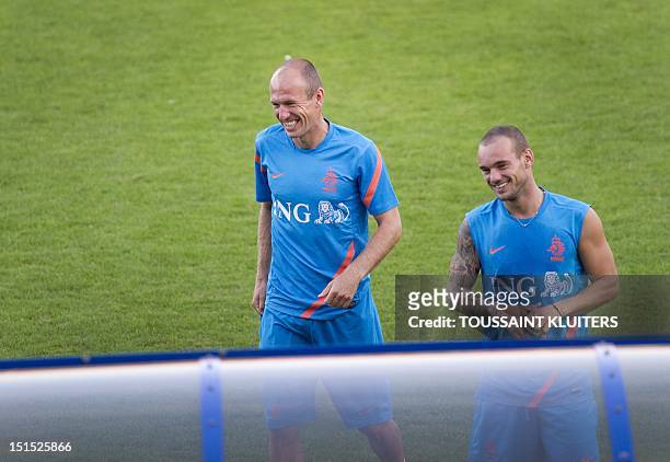 Dutch national football team players Arjen Robben and Wesley Sneijder train on September 8, 2012 in Katwijk ahead of a World Cup 2014 qualification...