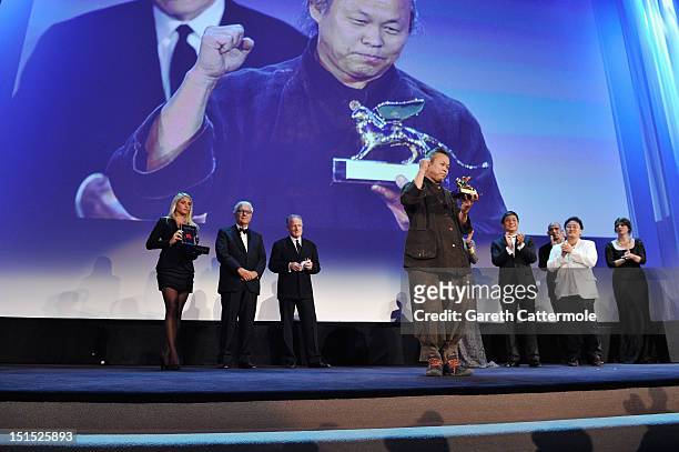 Director Kim Ki-Duk wins the Golden Lion for best film award on stage during the Award Ceremony at the 69th Venice Film Festival at the Palazzo del...