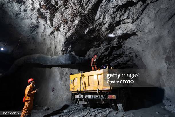 Workers work at the mining and beneficiating project of Zhugongtang lead and zinc mine in Zinche village, Shuitangbao Township, Hezhang County, Bijie...