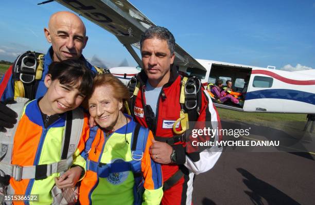 Ninety-five year old, French woman Blanche Olive and ten year old Pakistani-French teenager Oceane Malvy , pose with French paraglider pilots, Mario...