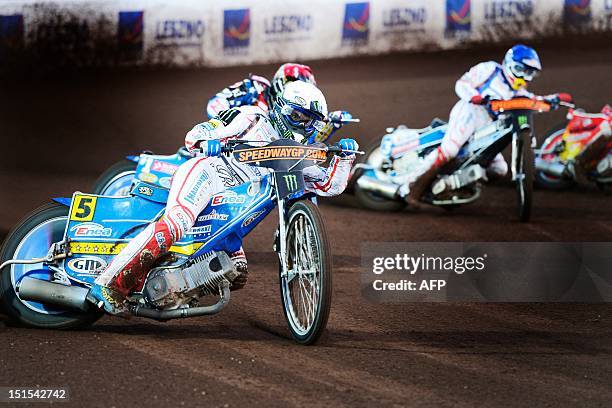 Poland's Tomasz Gollob and Jaroslaw Hampel compete during the FIM Scandinavian Speedway Grand Prix in Malilla, southern Sweden, on September 8, 2012....