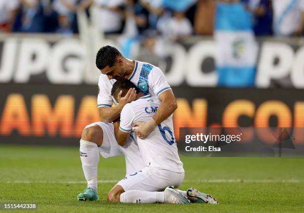 Carlos Mejía and Darwin Lom of Guatemala celebrate the win over Guadeloupe after the Group D match of the Concacaf Gold Cup at Red Bull Arena on July...