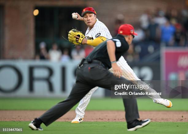 Ha-seong Kim of the San Diego Padres throws to first base to end the game against the Los Angeles Angels at PETCO Park on July 04, 2023 in San Diego,...
