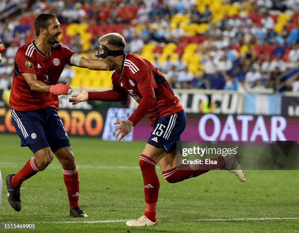 Francisco Calvo of Costa Rica celebrates his goal with teammate Celso Borges during the first half of the Group C match against Martinique in the...