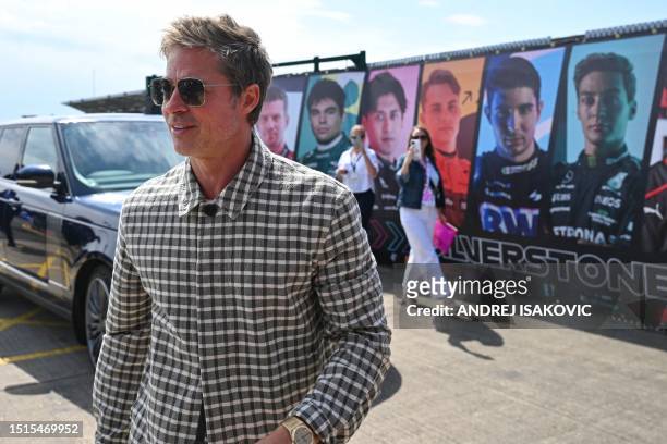 Actor Brad Pitt arrives for the Formula One British Grand Prix at the Silverstone motor racing circuit in Silverstone, central England on July 9,...