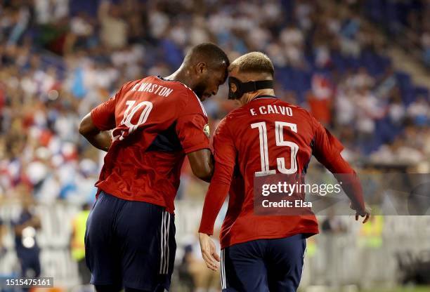Kendall Waston of Costa Rica celebrates his goal with teammate Francisco Calvo during the first half of the Group C match against Martinique during...