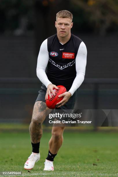 Jordan De Goey of the Magpies runs with the ball during a Collingwood Magpies AFL training session at Olympic Park Oval on July 05, 2023 in...