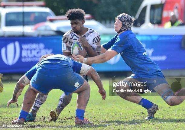 Waqa Nalaga of Fiji tackled by Marcos Gallorini and Enrico Pontarini of Italy during the World Rugby U20 Championship 2023, 9th Place semi final...