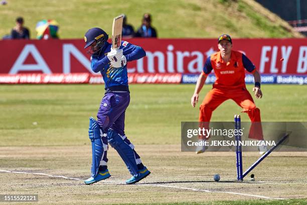 Sri Lanka's Dhananjaya de Silva loses his wicket during the ICC Men's Cricket World Cup Qualifier Zimbabwe 2023 final match between Sri Lanka and...