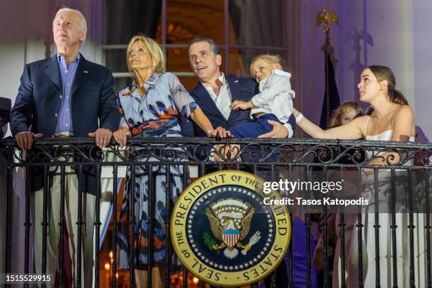 President Joe Biden, first lady Jill Biden, Hunter Biden holding Beau Biden and Naomi Biden watch fireworks on the South Lawn of the White House on...