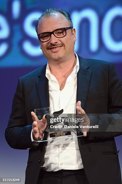 Director Frederic Fonteyne receives the Special Orizzonti jury prize for full-length films for his film 'Tango Libre' during the Award Ceremony...
