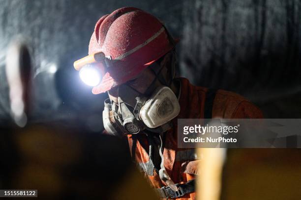 Workers are working at the mining and beneficiating project of Zhugongtang lead and zinc mine in Zinche village, Shuitangbao Township, Hezhang...