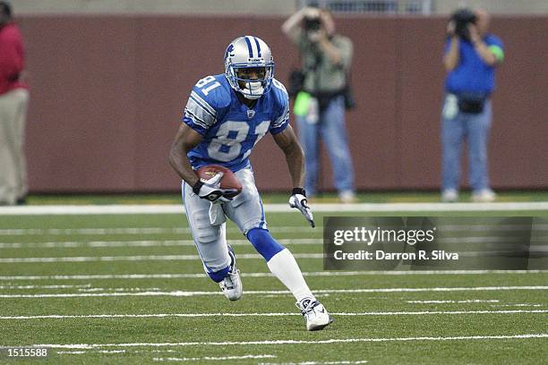 Wide receiver Az-Zahir Hakim of the Detroit Lions carries the ball during the game against the New Orleans Saints on September 29, 2002 at Ford Field...