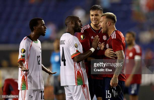 Enrick Reuperné and Cyril Mandouki of Martinique have words with Francisco Calvo and Juan Pablo Vargas of Costa Rica after the Group C match of the...