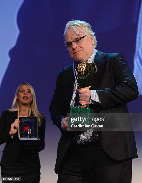 Actor Philip Seymour Hoffman wins the Coppa Volpi award for best actor before receiving a Jaeger-LeCoultre watch on stage during the Award Ceremony...