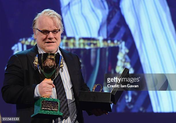 Actor Philip Seymour Hoffman wins the Coppa Volpi award for best actor in 'The Master' and receives a Jaeger-LeCoultre watch on stage during the...