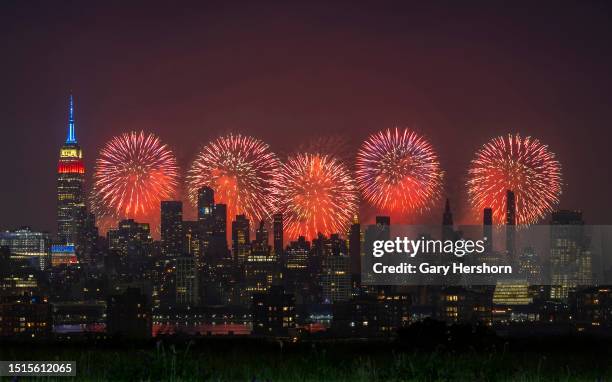 Macy's 4th of July fireworks light up the sky next to the Empire State Building in New York City on July 4 as seen from Union City, New Jersey.