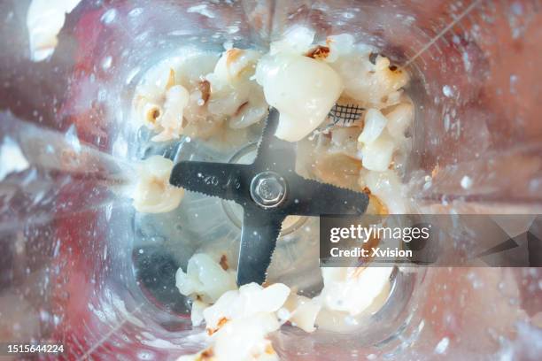 litchi fruit under high speed blending synced in high speed photography - blender splash stock pictures, royalty-free photos & images