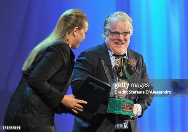 Philip Seymour Hoffman receieves the Coppa Volpi award for best actor from jury member Samantha Morton during the Award Ceremony during The 69th...