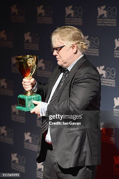 Actor Philip Seymour Hoffman of "The Master" with the Coppa Volpi Award for "Best Actor" during the Award Winners Photocall during The 69th Venice...